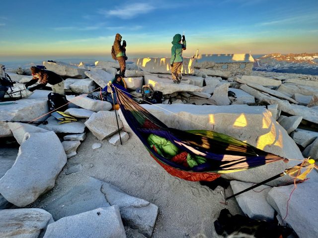 Yes, I pitched my hammock on the summit of Mt. Whitney, highest point in the Americas between Alaska and the Andes. It was about 20ºF and windy, so hanging to stay warm before dawn in my quilts was the best way. Hammocking in unlikely places is the new planking, according to my opinion anyway.